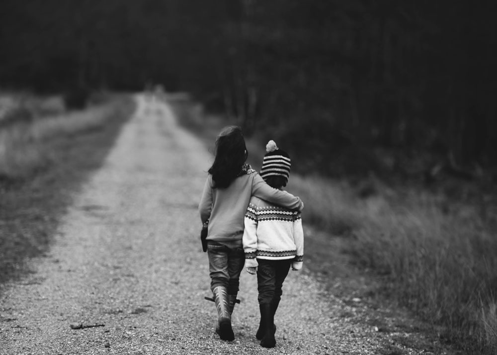 two kids walking together